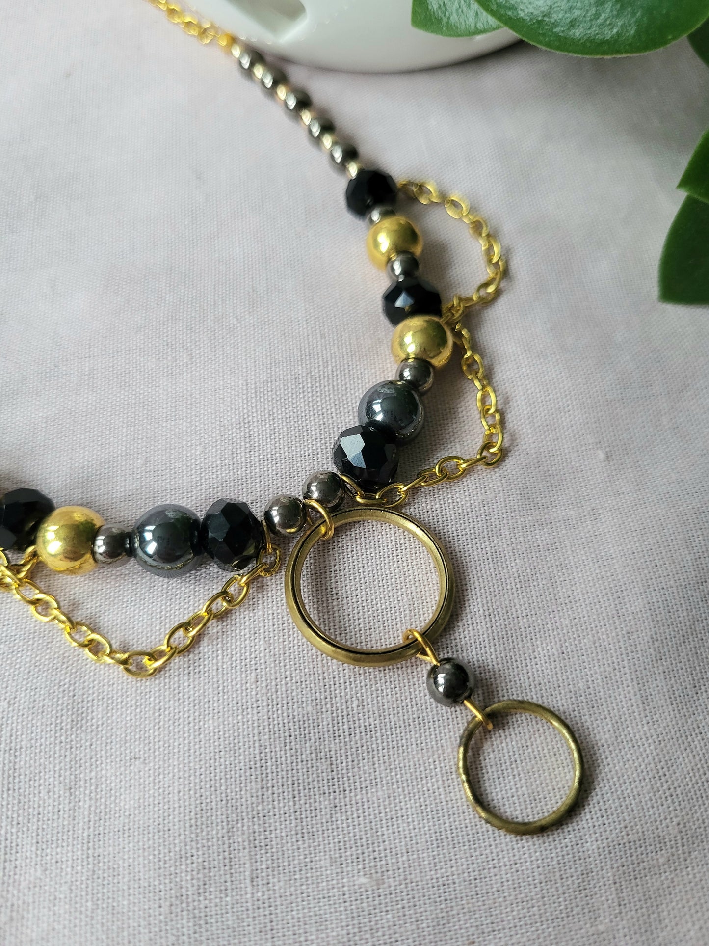 Black and Gold Upcycled Beaded Bib Necklace with Double Ring Drop Pendant and Chain Detail